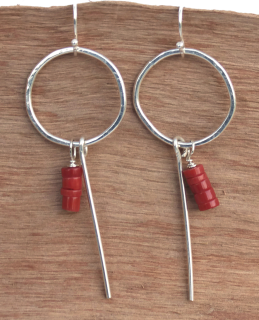 sterling coral earrings on wood