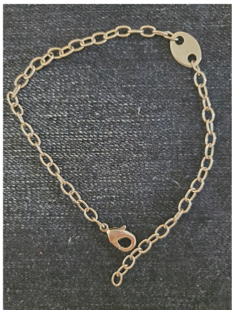 hypoallergenic chain tag anklet on denim