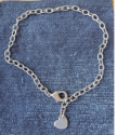 silver heart anklet on denim