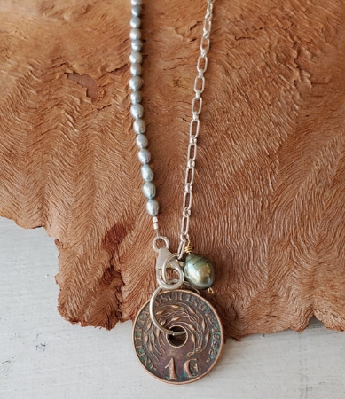 Blue pearl silver chain Nederland coin necklace on wood