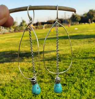 Big fun silver turquoise statement earrings with grass background