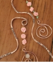 Copper crystal spiral bookmarks on wood