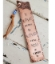 handcrafted hammered copper bookmark on white wood