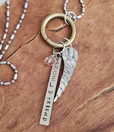 Angel wing chain silver necklace on wood