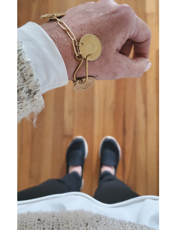 chunky coin bracelet worn on wrist