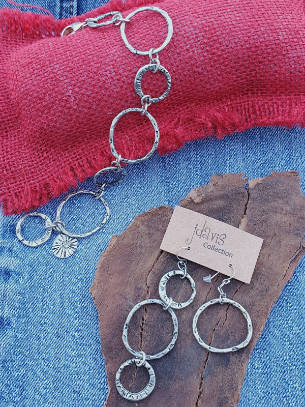 circle jewelry on denim