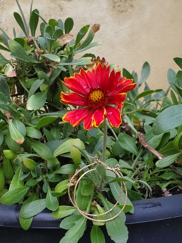 flowers and gold hoop earrings