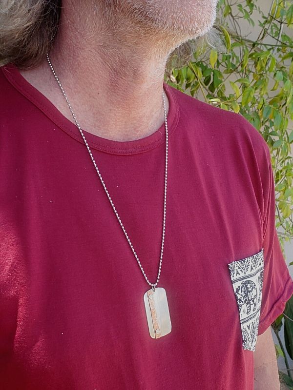 artisan dog tag necklace worn on male