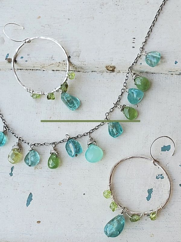 on white wood blue green gemstone necklace and earrings