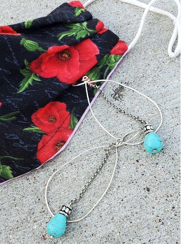 mask with fun earrings displayed