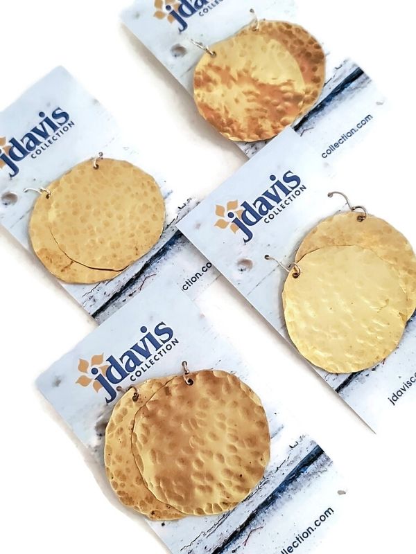 big gold disc earrings in a row