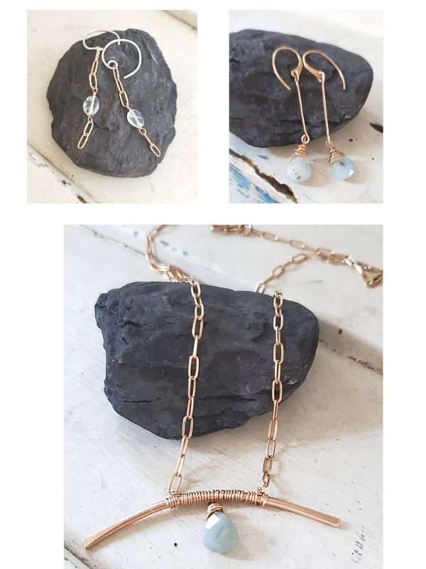 blue aquamarine gemstone jewelry on rock