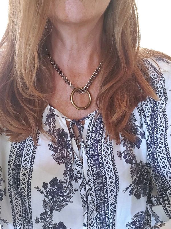 heavy silver chain statement necklace being worn