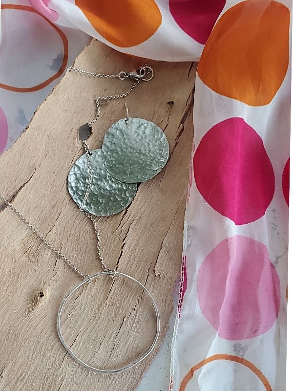 circle earrings, necklace and scarf displayed