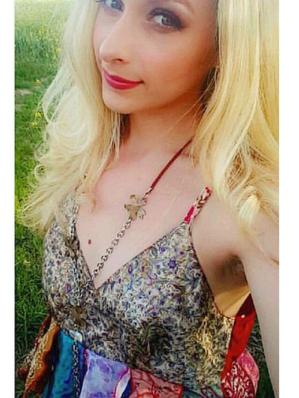 Long flower necklace on female in flower field