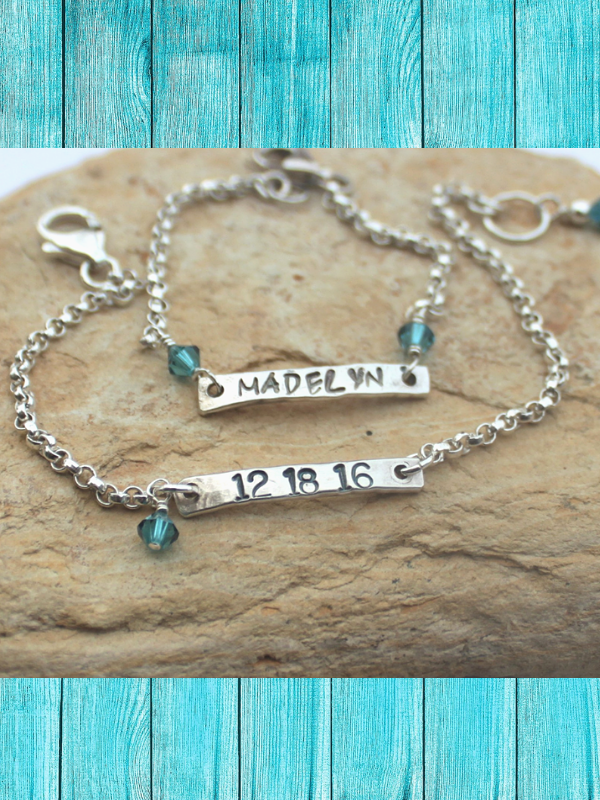 sterling mommy & me bracelets on rock and teal wood