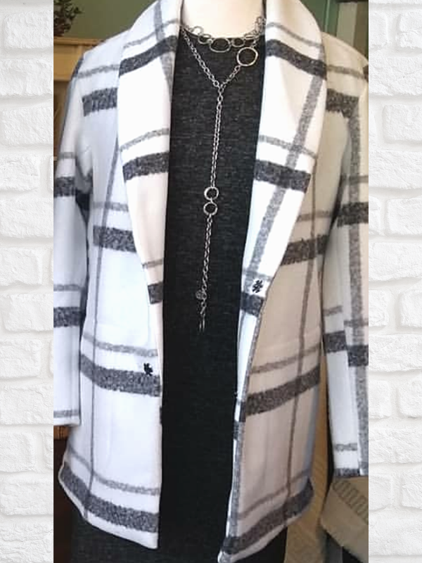 plaid coat with long statement necklace