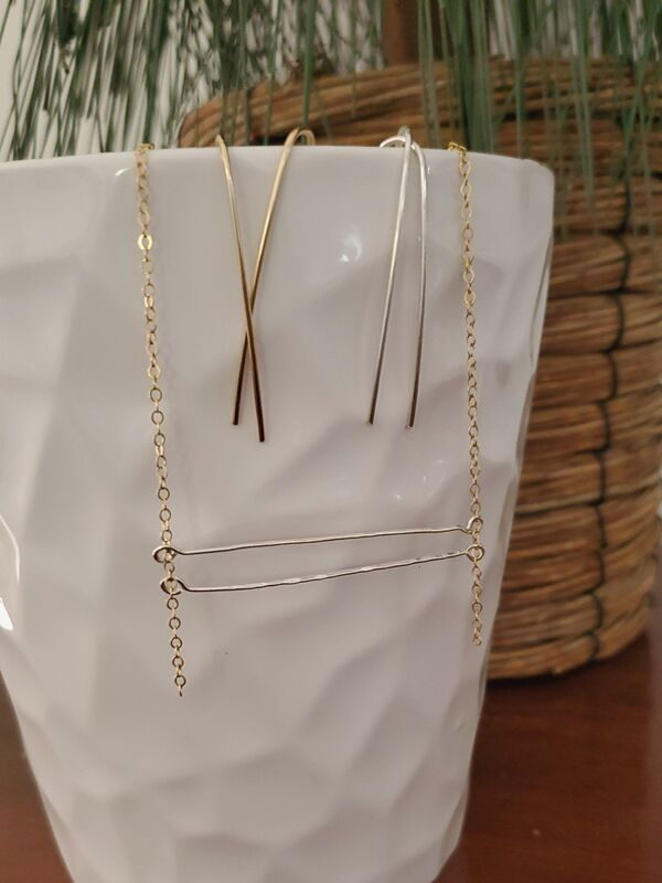 white vase with arc earrings and bar necklace