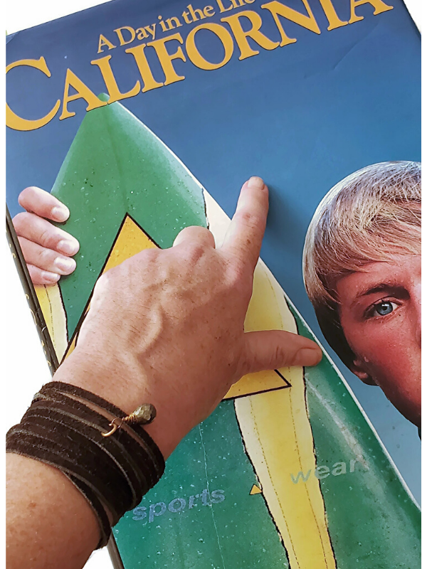 wrap bracelet on wrist with book